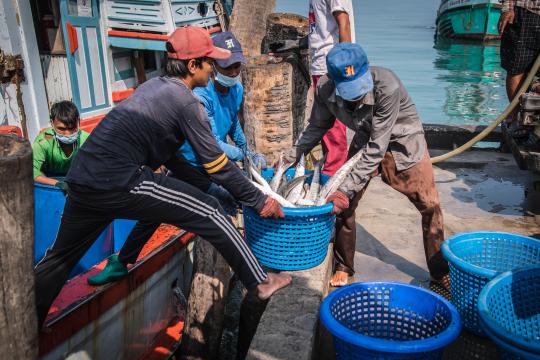 fishermen working on boat